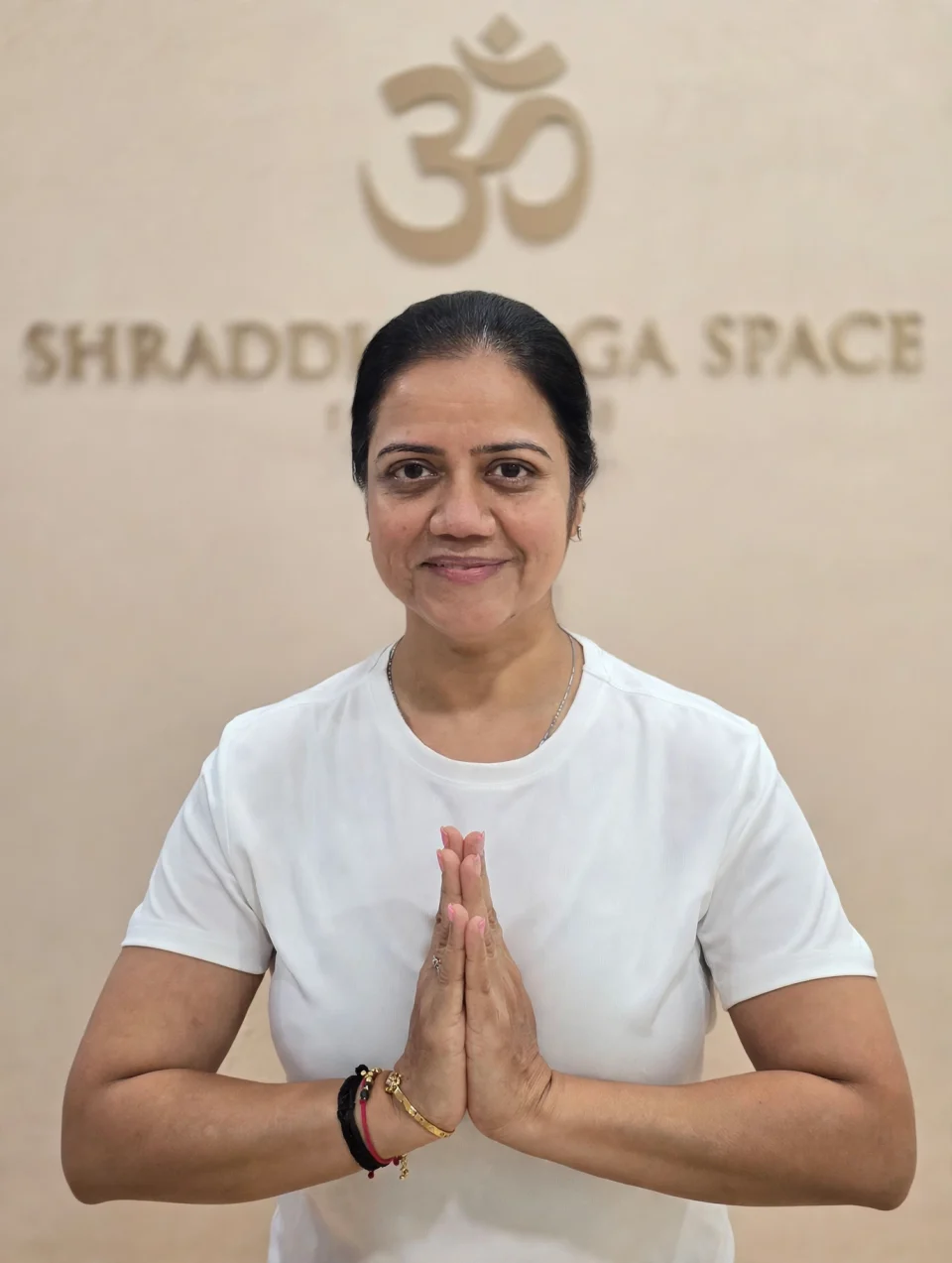 Darshana Shah, founder and yoga instructor, greeting with folded hands