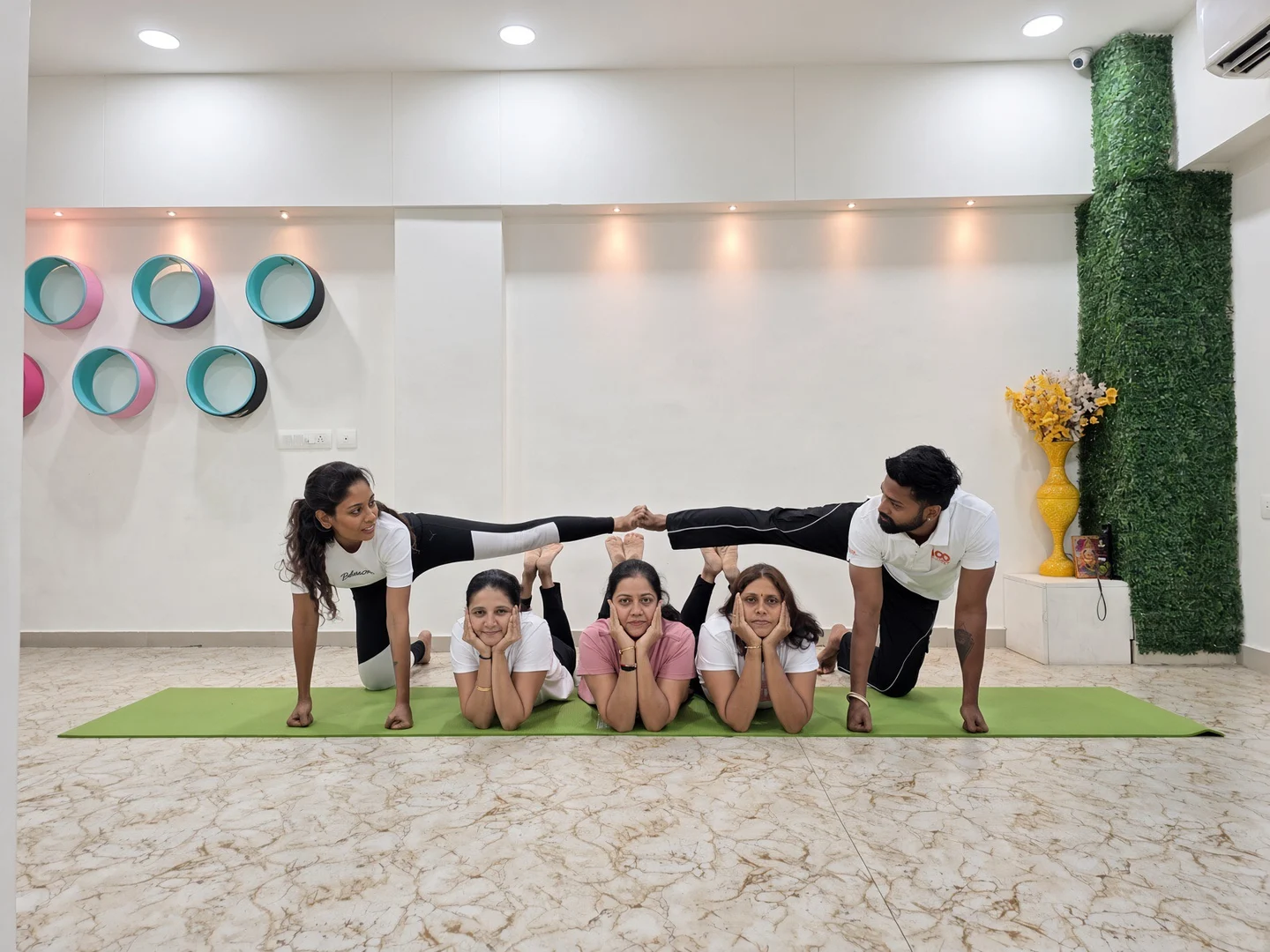 A group sharing a yoga moment inside Shraddha Yoga Space